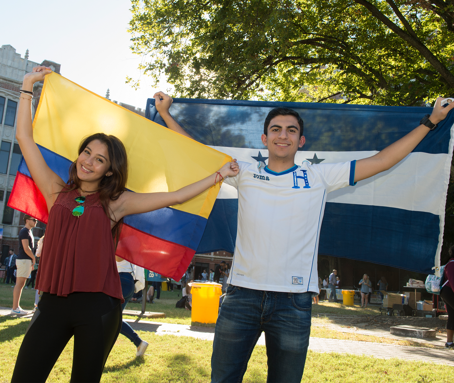 Two Loyola Students with Flags