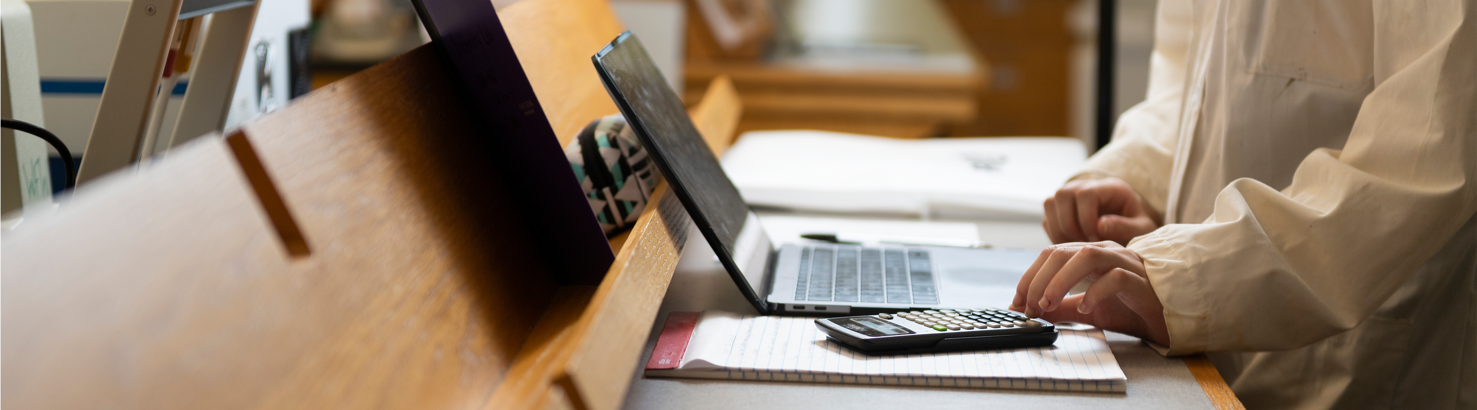 Student With Calculator and Computer