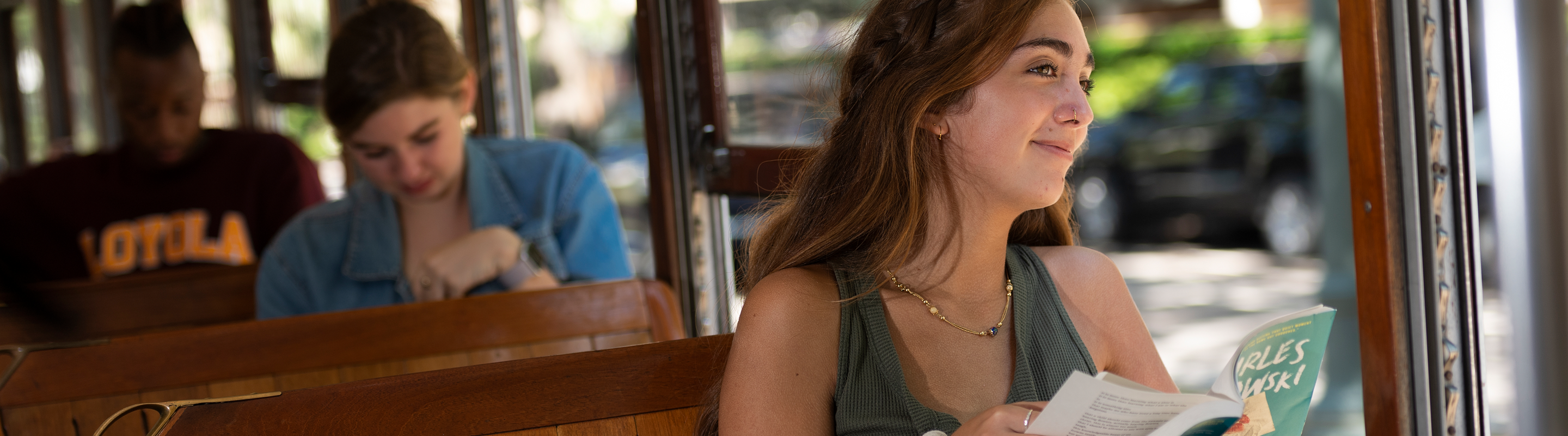 Student Reading on Streetcar