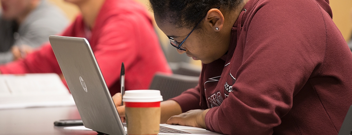 Student Writing in Class