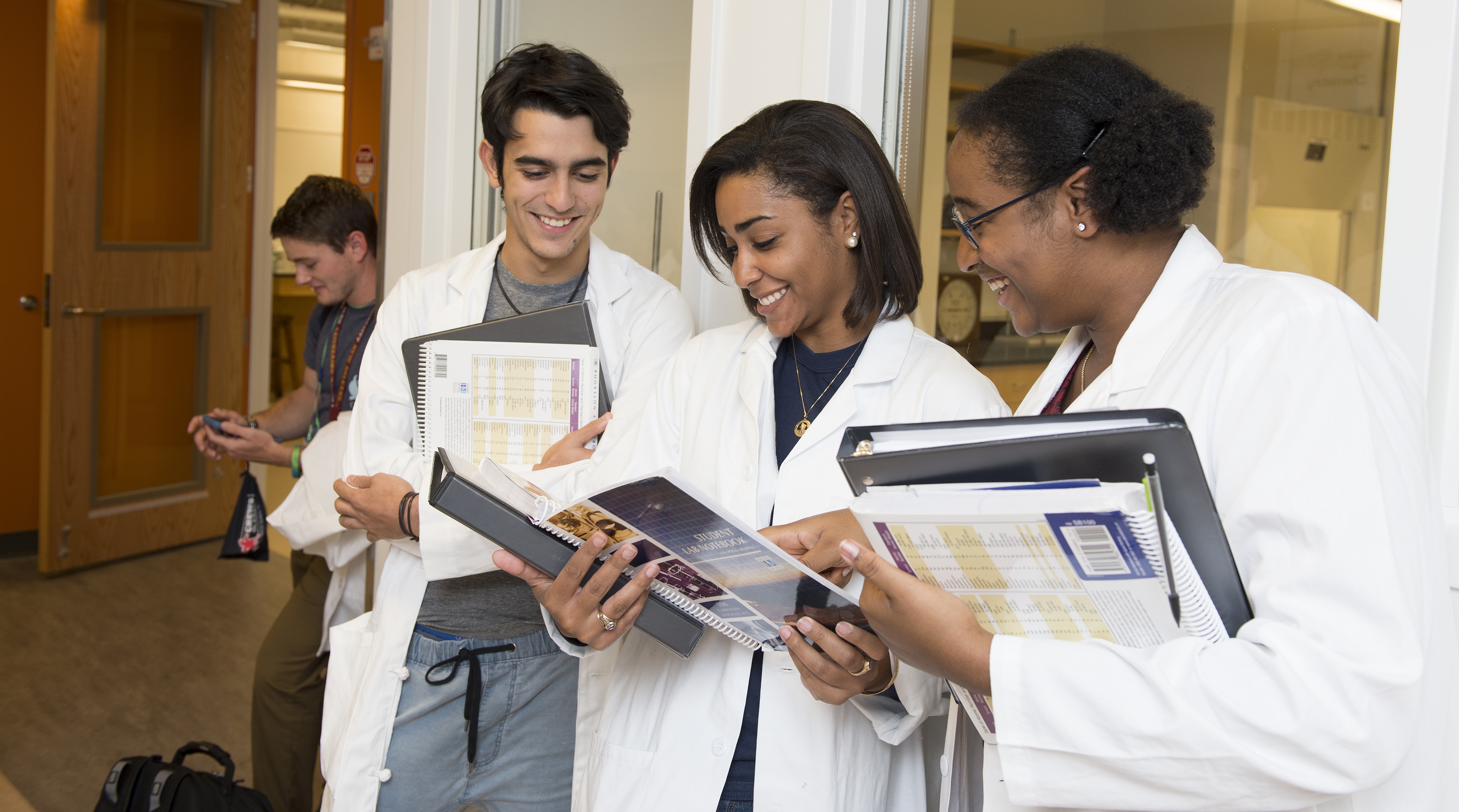 A group of Forensic Chemistry students discussing their findings