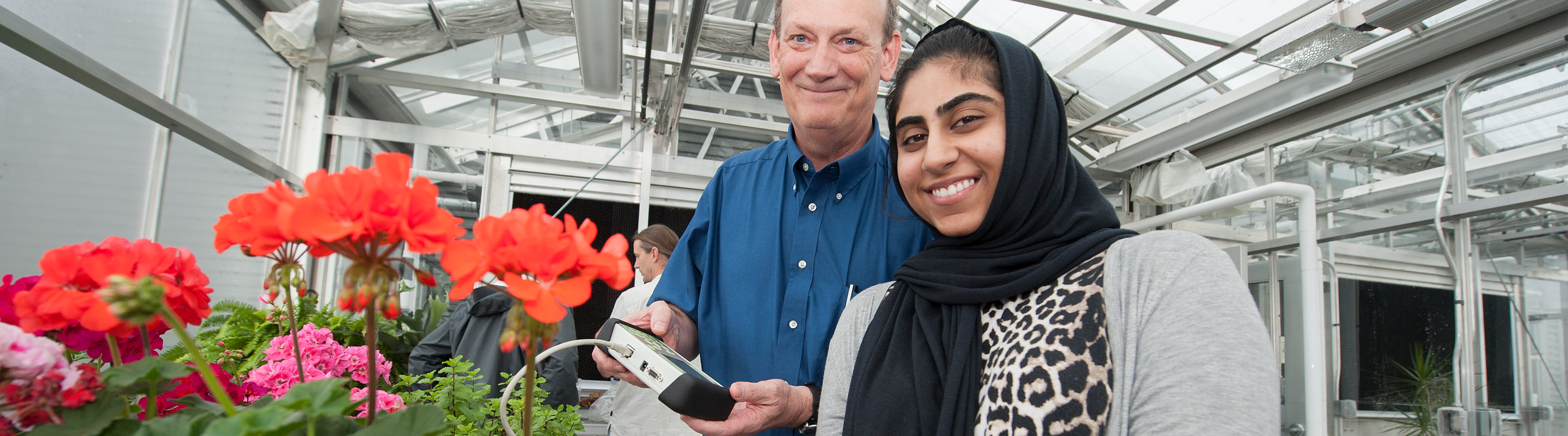Greenhouse Student and Professor