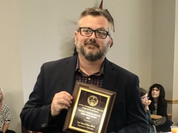 Joel MacClellan Receives Award for Excellence in Research
