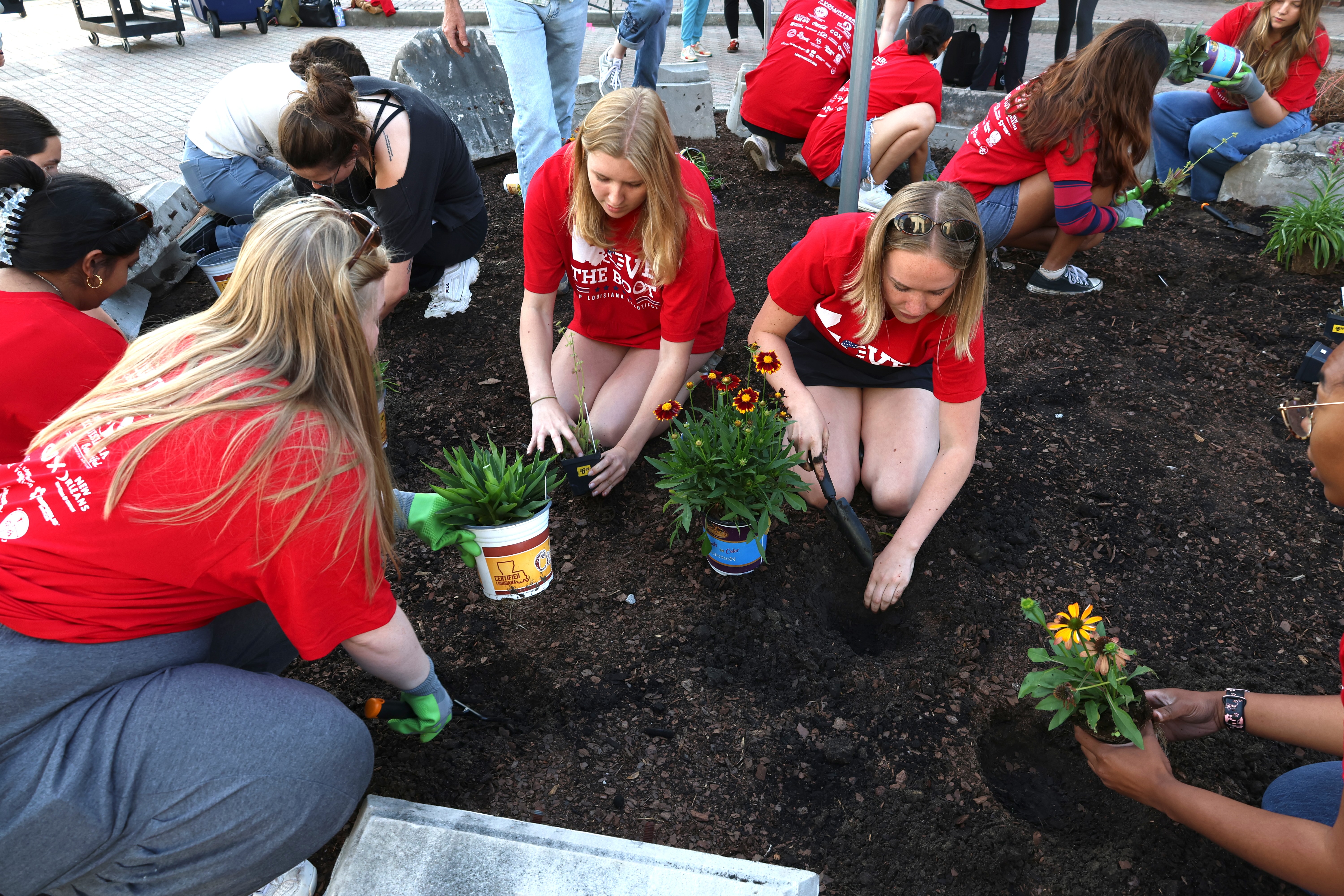 Students planting in the Dittmann pollinator garden
